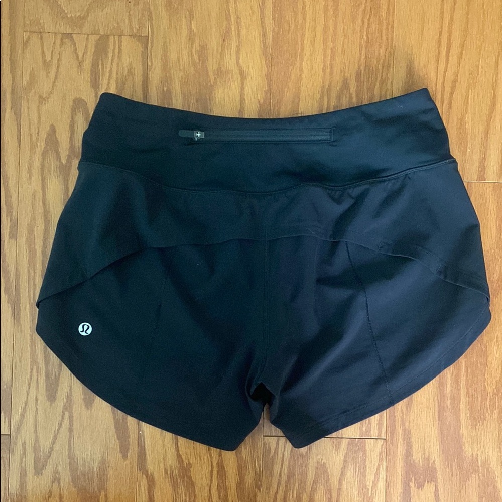LuluLemon size 4 Black Athletic Shorts with Curved Hem and Elastic Waistband